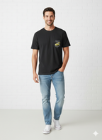 Man wearing a black t-shirt with a pocket design and light blue jeans on a white background