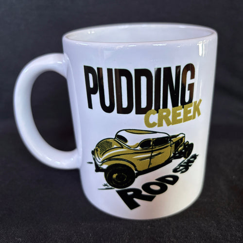 White mug with 'Pudding Creek Rod Shop' design featuring a vintage car on a black background