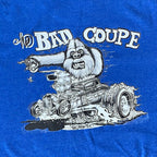 Blue t-shirt with a graphic of a yeti driving a hot rod and 'The Bad Coupe' text.