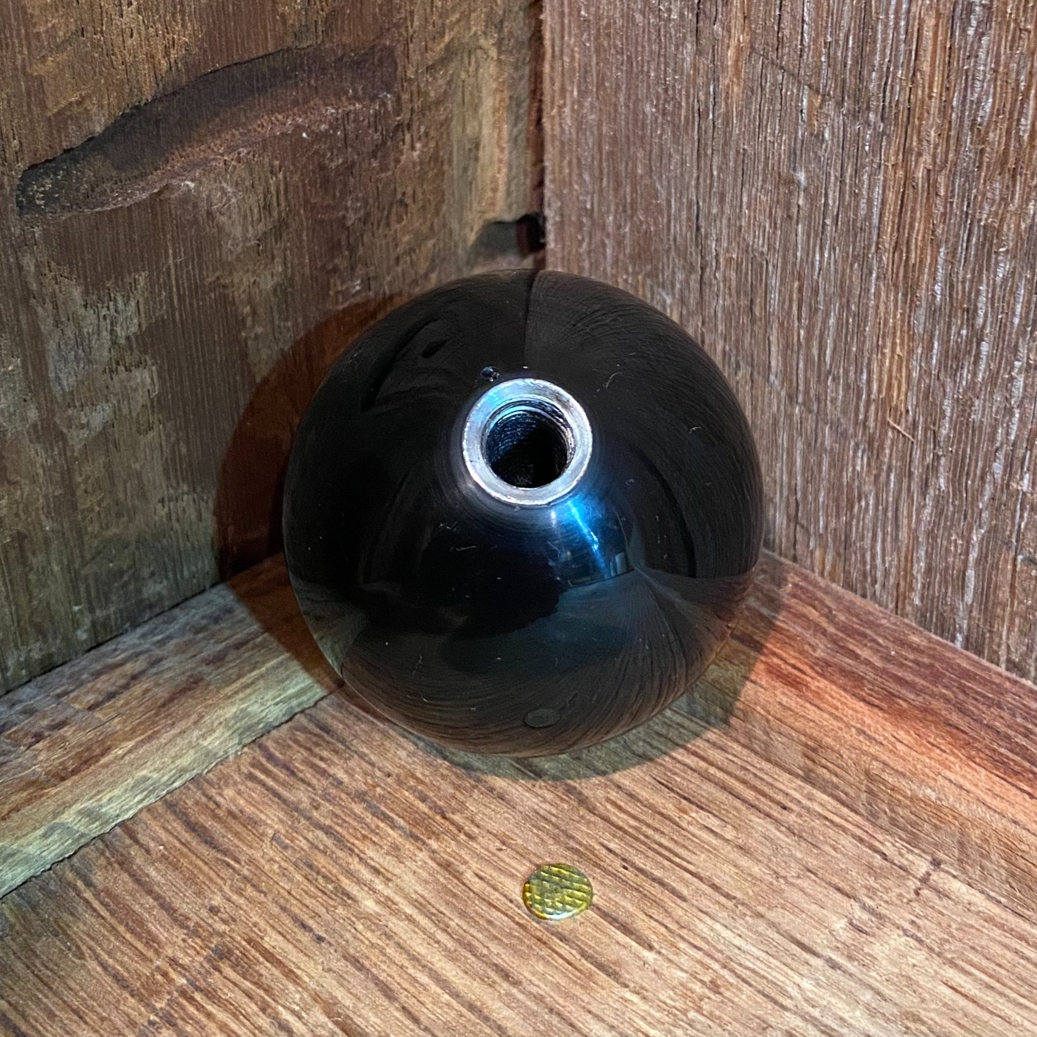 Bottom view of the Minnie Pearl Resin Shifter Ball in black, showing the deep gloss black resin finish and the 3/8-16 threaded steel insert for standard shifter installation