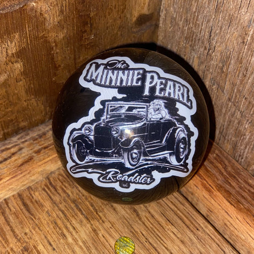Front view of the Minnie Pearl Resin Shifter Ball in black, showing the 1928 Ford Roadster hot rod graphic with The Minnie Pearl Roadster text in white ink sealed under a crystal-clear dome