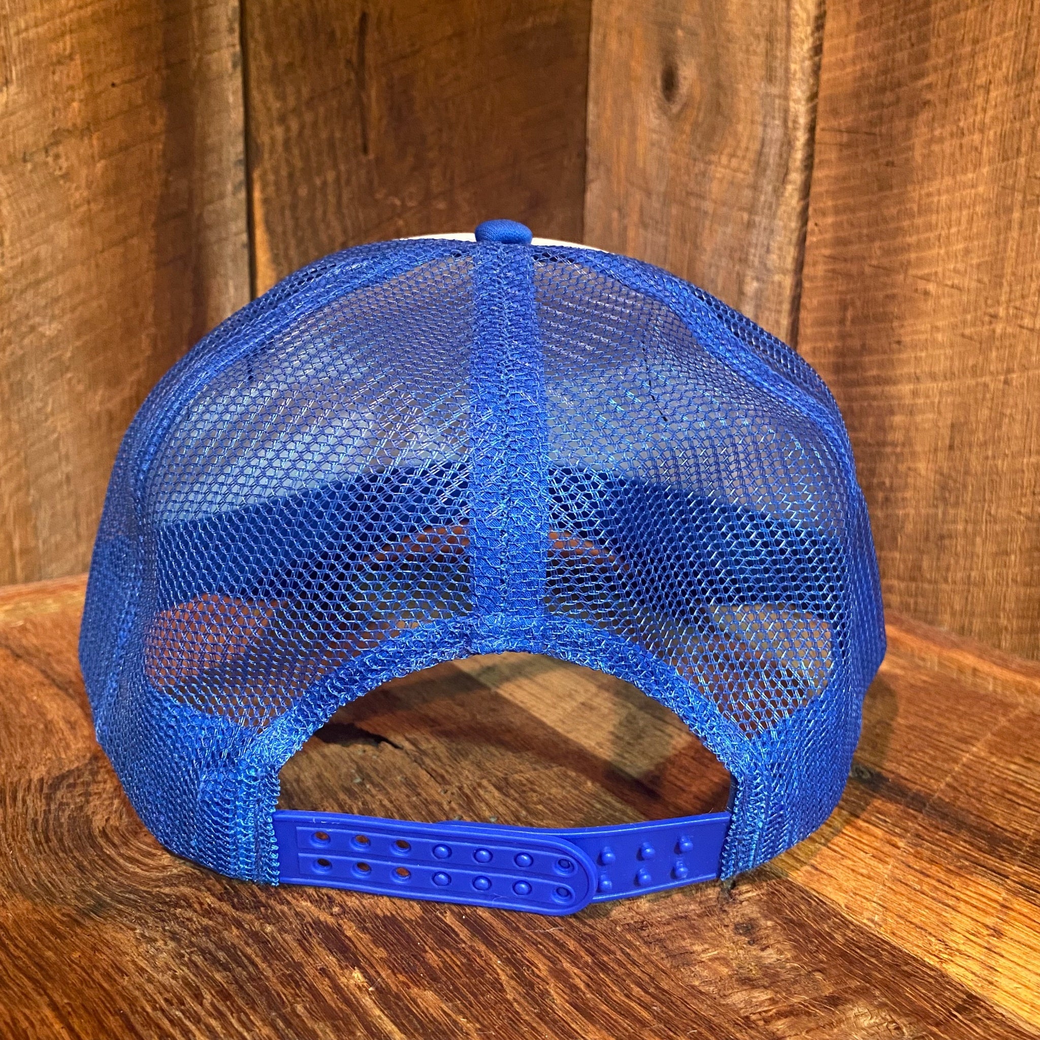 Back view of The Bad Coupe Yeti Foam Trucker Hat showing the white mesh trucker back and adjustable snapback closure