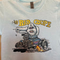 Close-up detail of The Bad Coupe Yeti graphic on the Ice Blue tee, showing the Yeti's white fur, the blown coupe engine, and the Von Franco signature, with the Next Level apparel neck tag visible