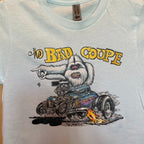 Close-up detail of The Bad Coupe Yeti graphic on the Ice Blue tee, showing the Yeti's white fur, the blown coupe engine, and the Von Franco signature, with the Next Level apparel neck tag visible